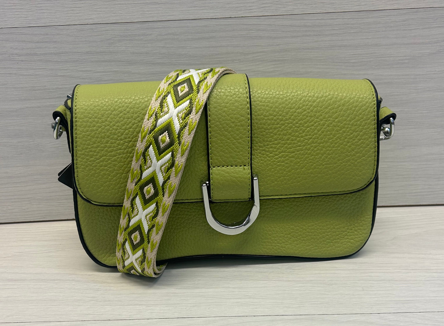Lime buckle across bag