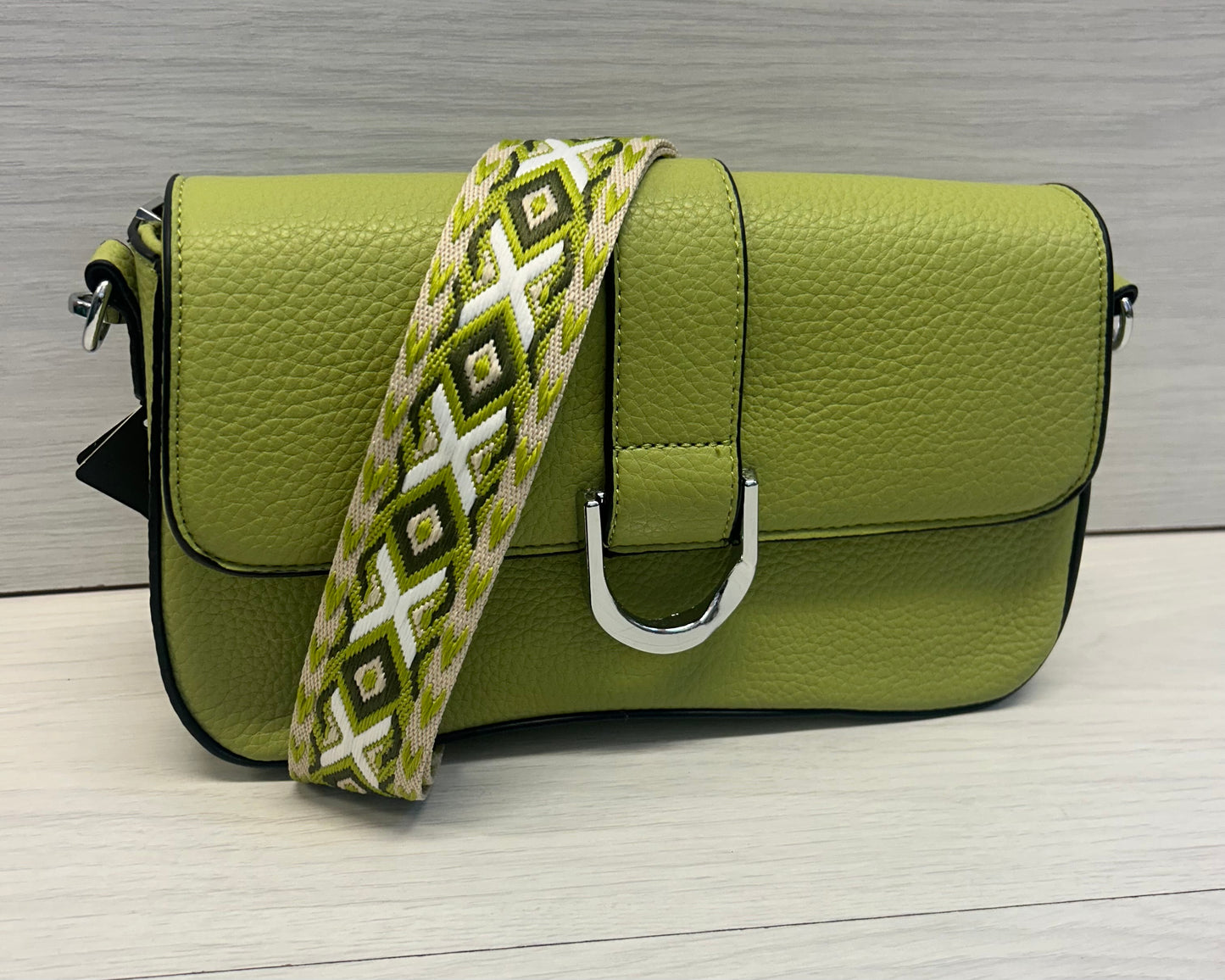 Lime buckle across bag