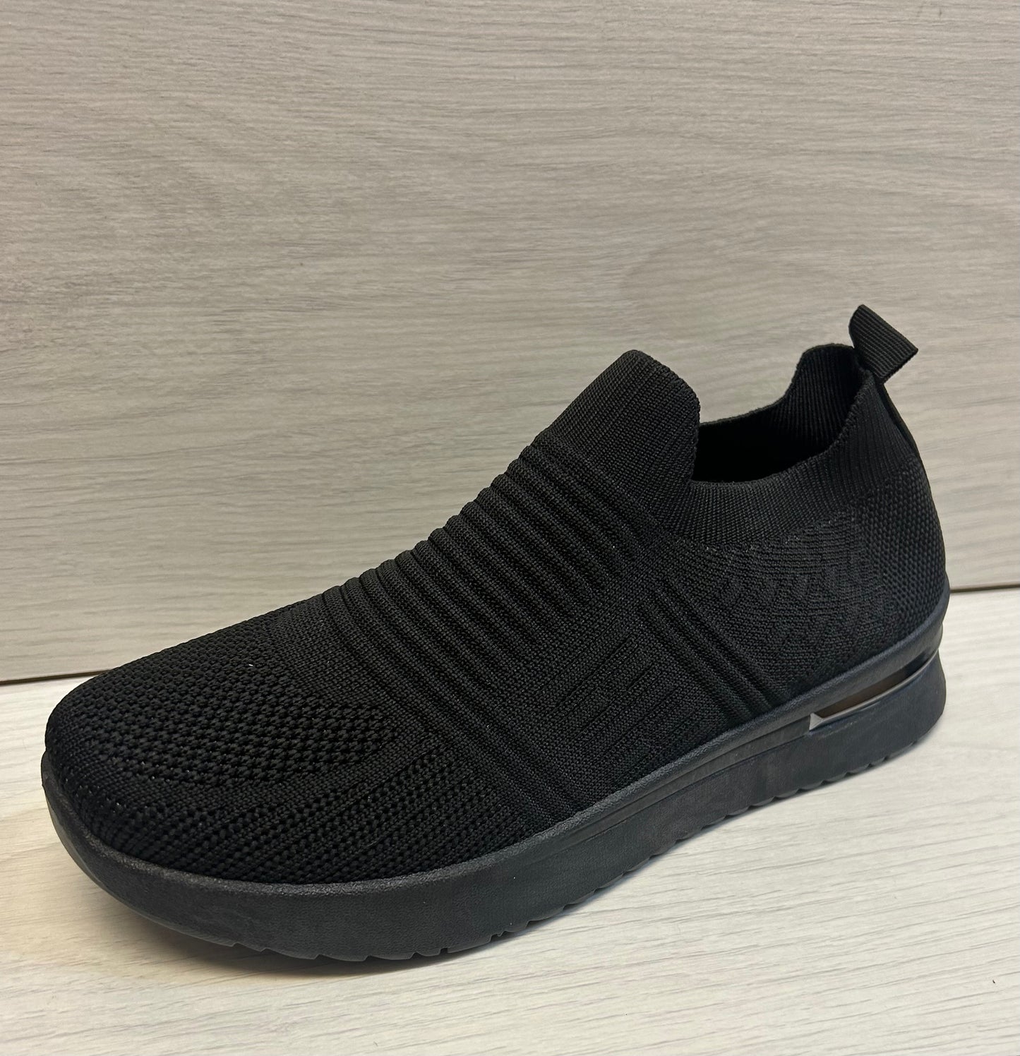 All Black stretch trainers